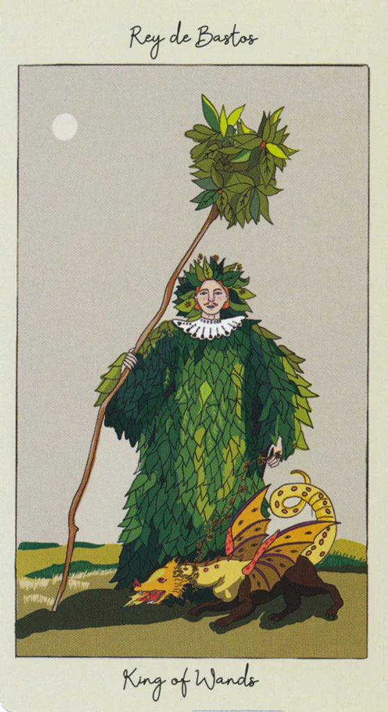 Card from a tarot deck featuring a person in a leafy costume with a staff and a small creature, labeled 'King of Wands'.