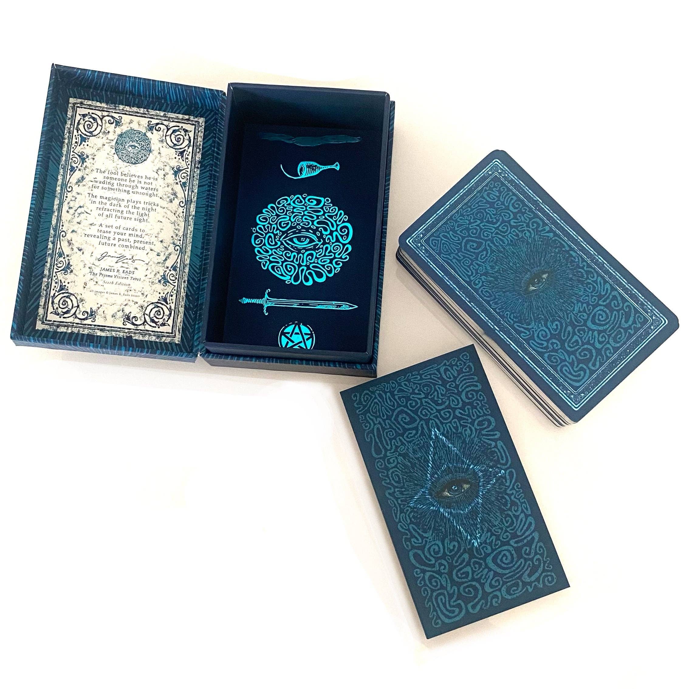Blue playing cards with intricate designs on a white background
