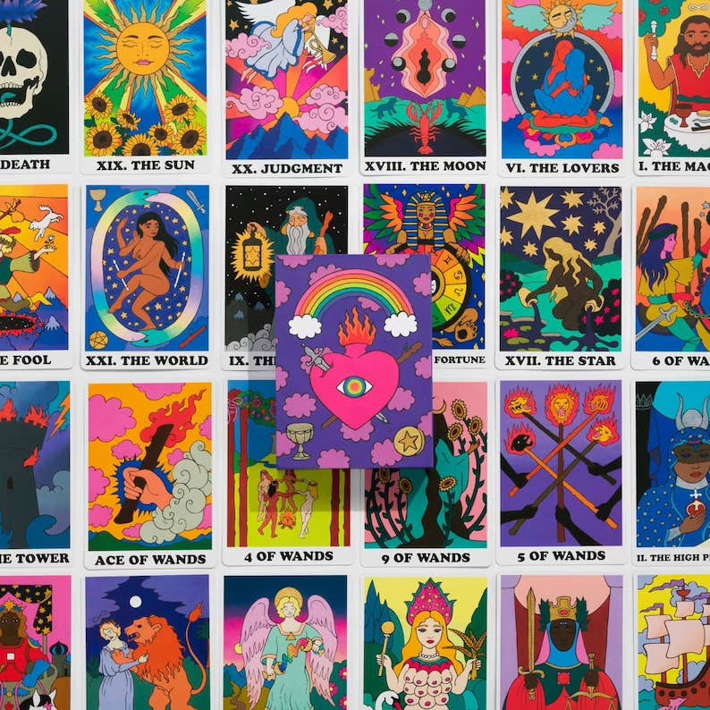 Collection of colorful tarot cards with various symbols and designs.