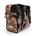 A rectangular zippered cosmetic bag featuring a dark baroque-style print with a robed figure, ornate floral patterns, and a decorative strap, photographed on a white background.