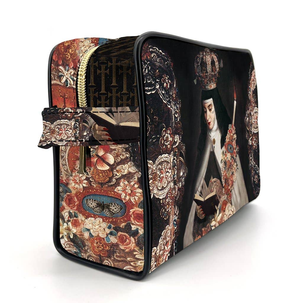 A rectangular zippered cosmetic bag featuring a dark baroque-style print with a robed figure, ornate floral patterns, and a decorative strap, photographed on a white background.