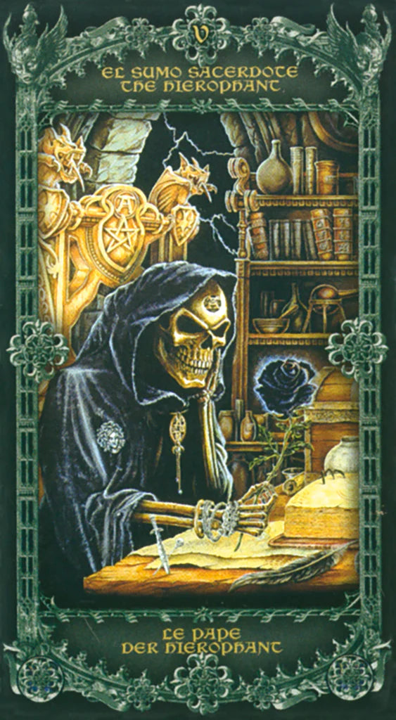 Tarot card featuring a skeleton in a robe with gold accents, sitting at a desk in a room with shelves and a dragon emblem.