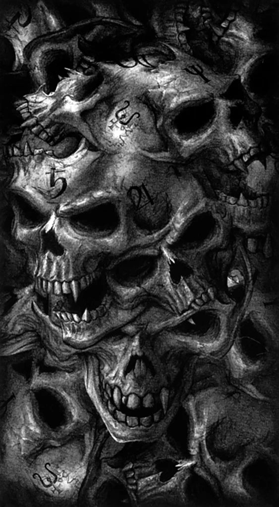Stack of skulls with intricate details and tattoos on a dark background
