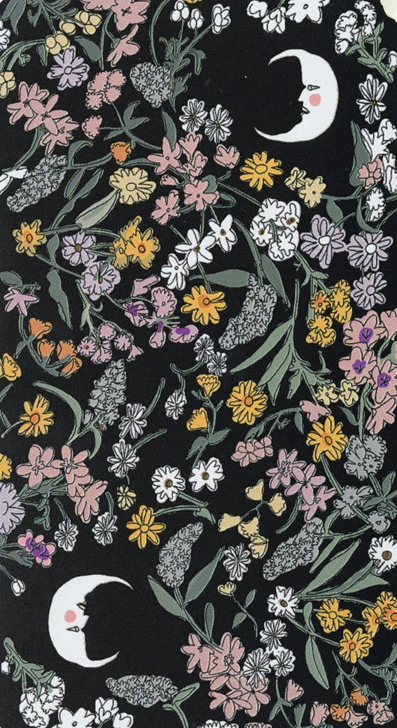 Floral pattern with moon and star designs on a black background