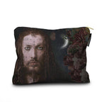 A rectangular zippered pouch featuring a dark, artistic print of a man's face with tattoos, a crescent moon, butterflies, and dark flowers on the right side. The pouch is shown on a clean white background with a small black brand tag on the right edge that reads 'AUGUST'.