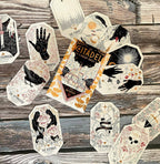 Collection of tarot cards on a wooden surface with 'The Citadel' book.