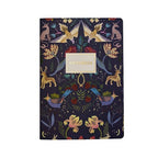 Notebook with a colorful animal and floral pattern on a dark blue background