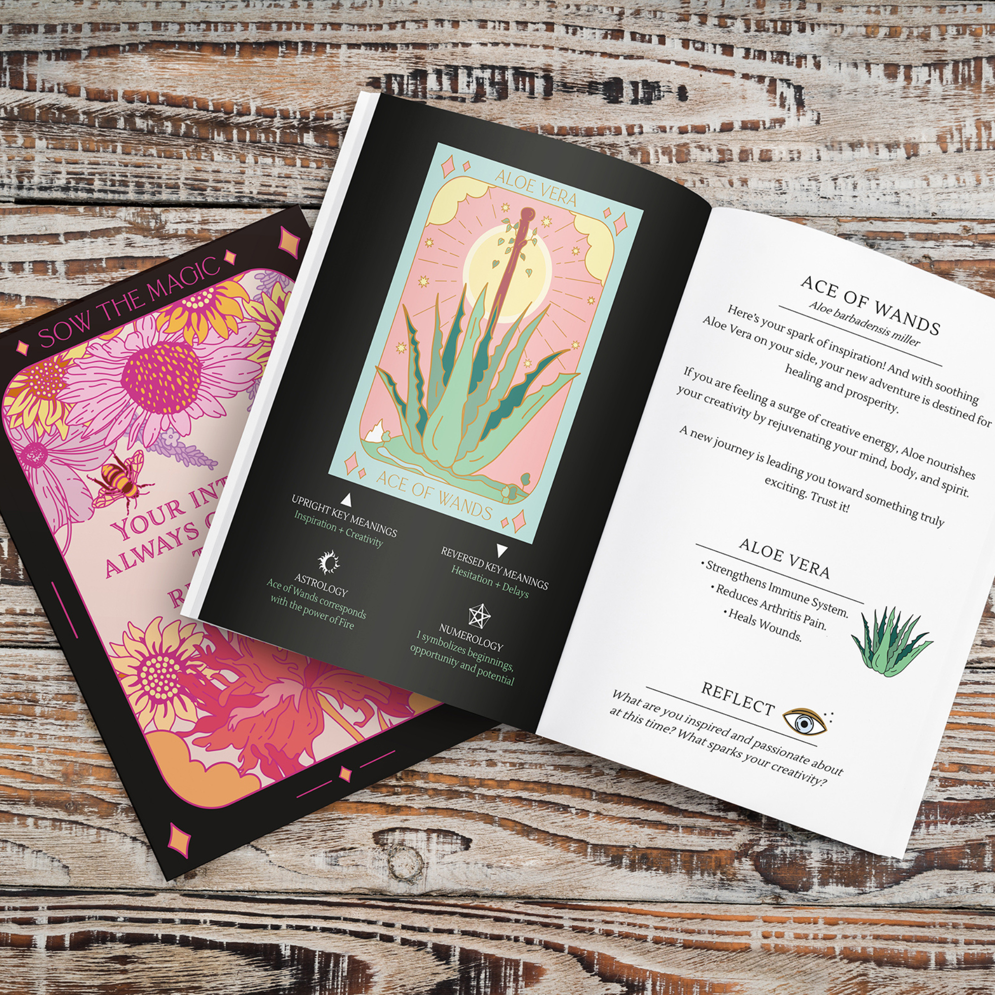 Two tarot cards with colorful designs on a wooden surface
