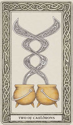 Two cauldrons with a snake coiled above them on a card with Celtic knot design.