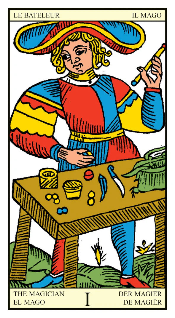 Card from a tarot deck featuring 'The Magician' with colorful attire and table.