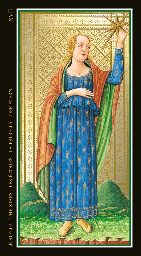 Card XVII The Stars from a tarot deck featuring a woman in a blue dress holding a star, with decorative border and text on the sides.