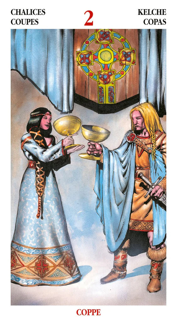 Tarot card featuring two figures in elaborate clothing with a colorful banner in the background.