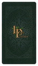 Dark green book with embossed design and 'Lyra Parker' logo