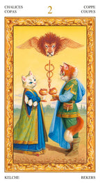 Card from a tarot deck with two fox-like figures holding cups, surrounded by ornate gold border and text.