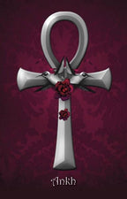 Silver ankh symbol with birds and flowers on a purple background