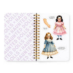 Notebook with illustrations of dolls on a white background