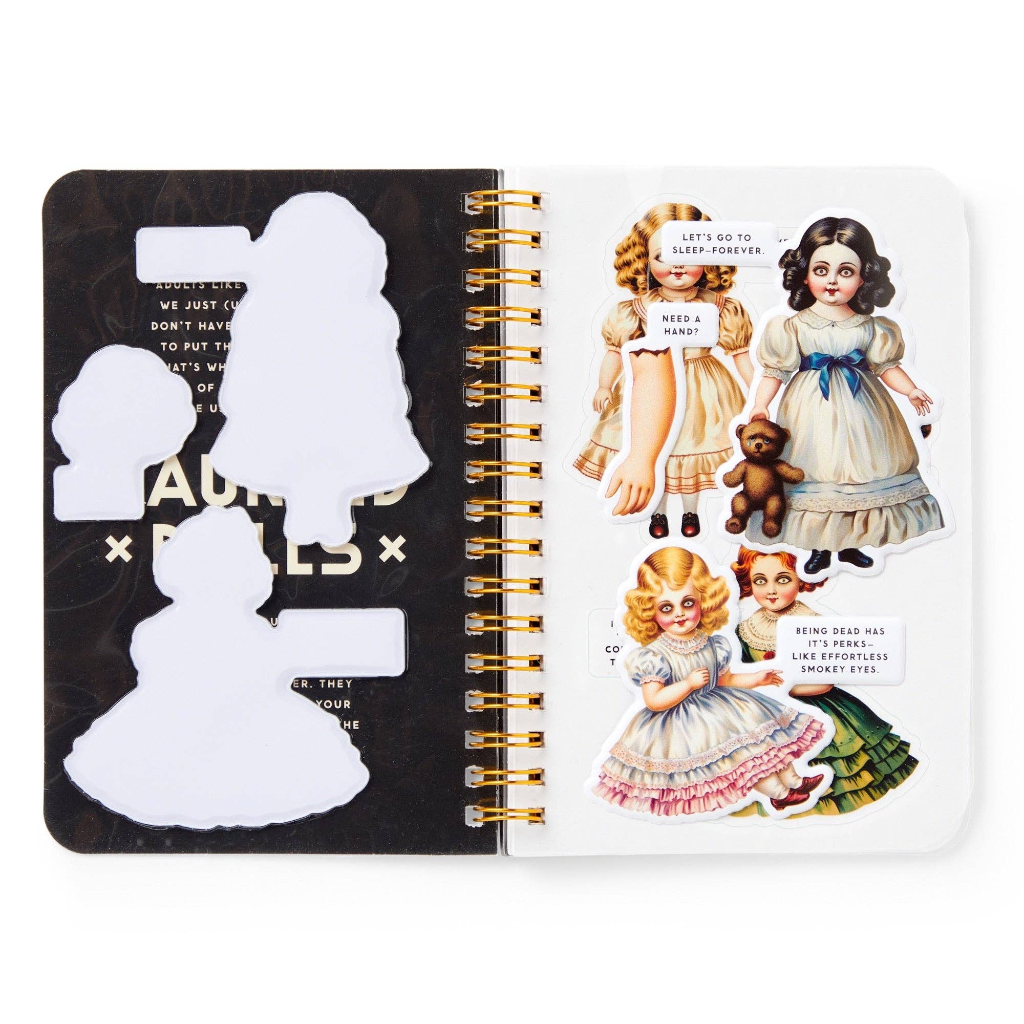 Open notebook with vintage-style illustrations of dolls and text on a white background