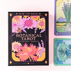 Botanical Tarot card deck with colorful floral design on a pink background