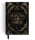 A tarot spread journal titled 'Seasons of Tarot' by Emma Howard, published by Darcel Sorley Publishing. The cover is black with intricate gold and brown illustrations of a stag, birds, a mushroom, a crescent moon, and a central butterfly, accented with gold lettering.
