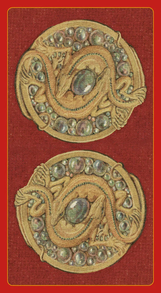 Decorative brooches with gemstones on a red background - the back of the Sexual Magic Tarot