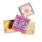 Four tarot card-style product packaging on a white background