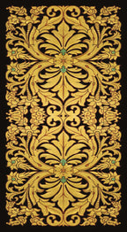 Decorative gold pattern with green accents on a black background