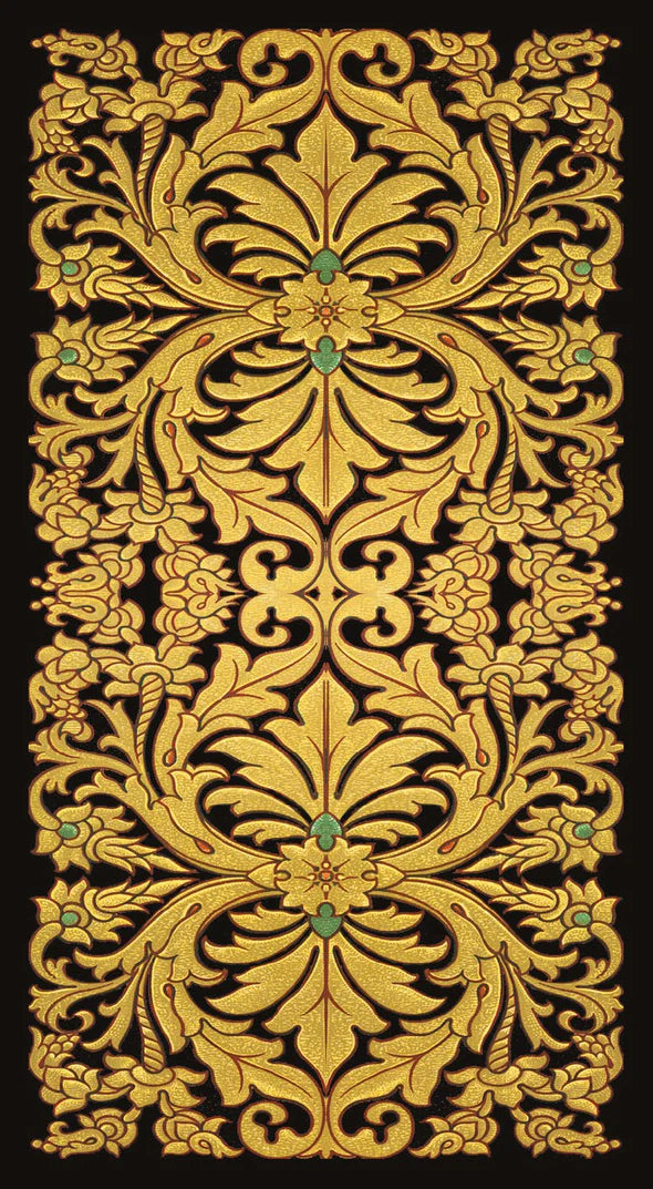 Decorative gold pattern with green accents on a black background