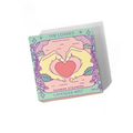 Shower steamers packaging with hands forming a heart and lavender design on a white background