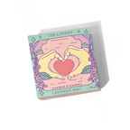 Shower steamers packaging with hands forming a heart and lavender design on a white background