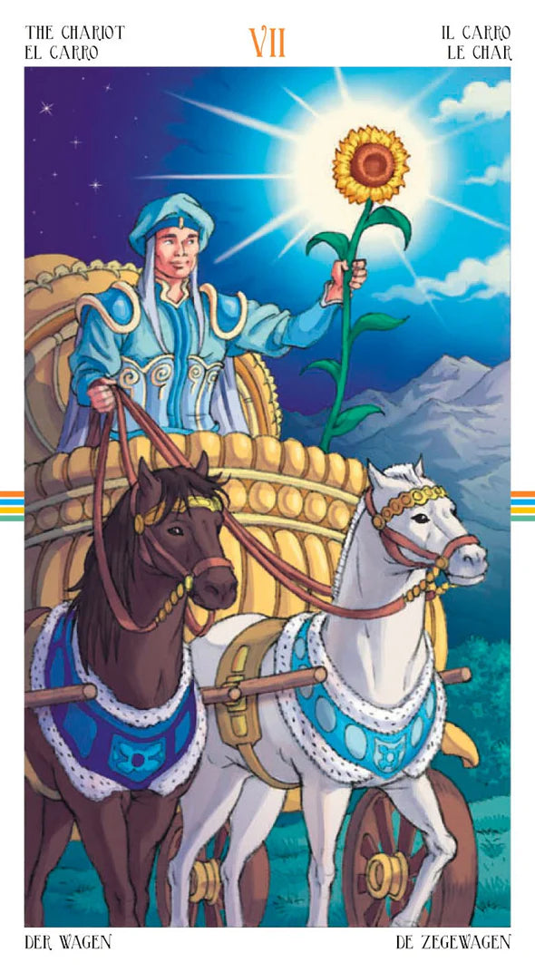 Tarot card featuring a person in a carriage with two horses, holding a sunflower against a mountainous background. VII The Chariot
