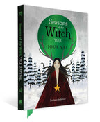 A hardcover journal titled "Seasons of the Witch Yule Journal" by Lorrie Anderson, featuring a dark green spine and cover with an illustration of a witch in a red cloak under a large green circle and snowy trees.