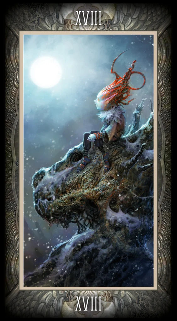 T tarot card with a person with long hair sitting on a rock under a moonlit sky.