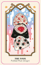 Card titled 'The Fool' featuring pickled plum onigiri with decorative elements on a pastel background.