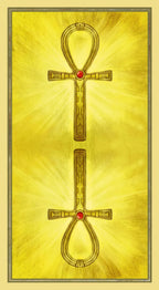 Ankh symbol with red gemstones on a yellow background