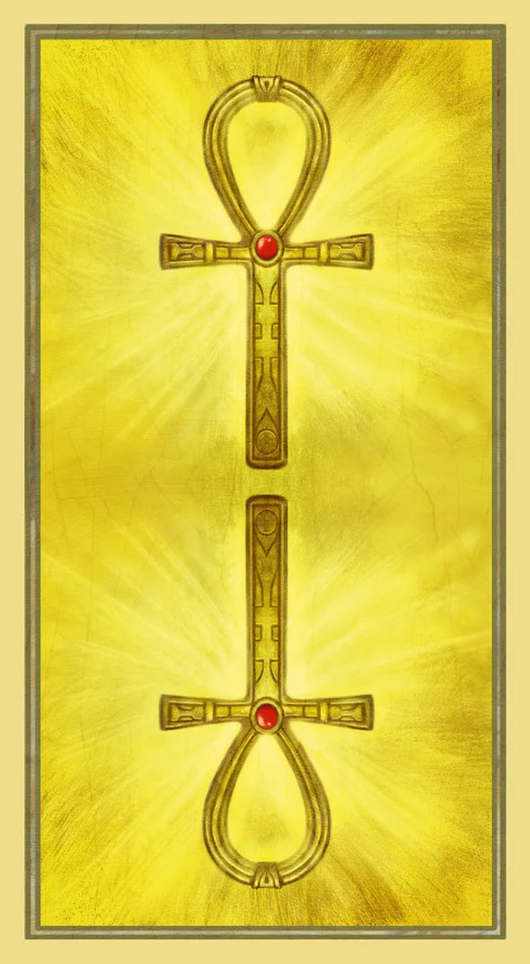 Ankh symbol with red gemstones on a yellow background