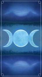 Triple moon symbol with a mystical landscape in the background