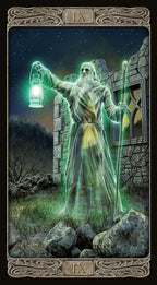 Tarot card featuring a figure with a lantern and staff in front of a stone building.