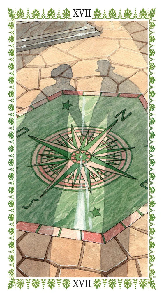 Decorative compass design on a stone floor with decorative border