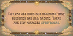 Motivational quote with decorative elements on a beige background