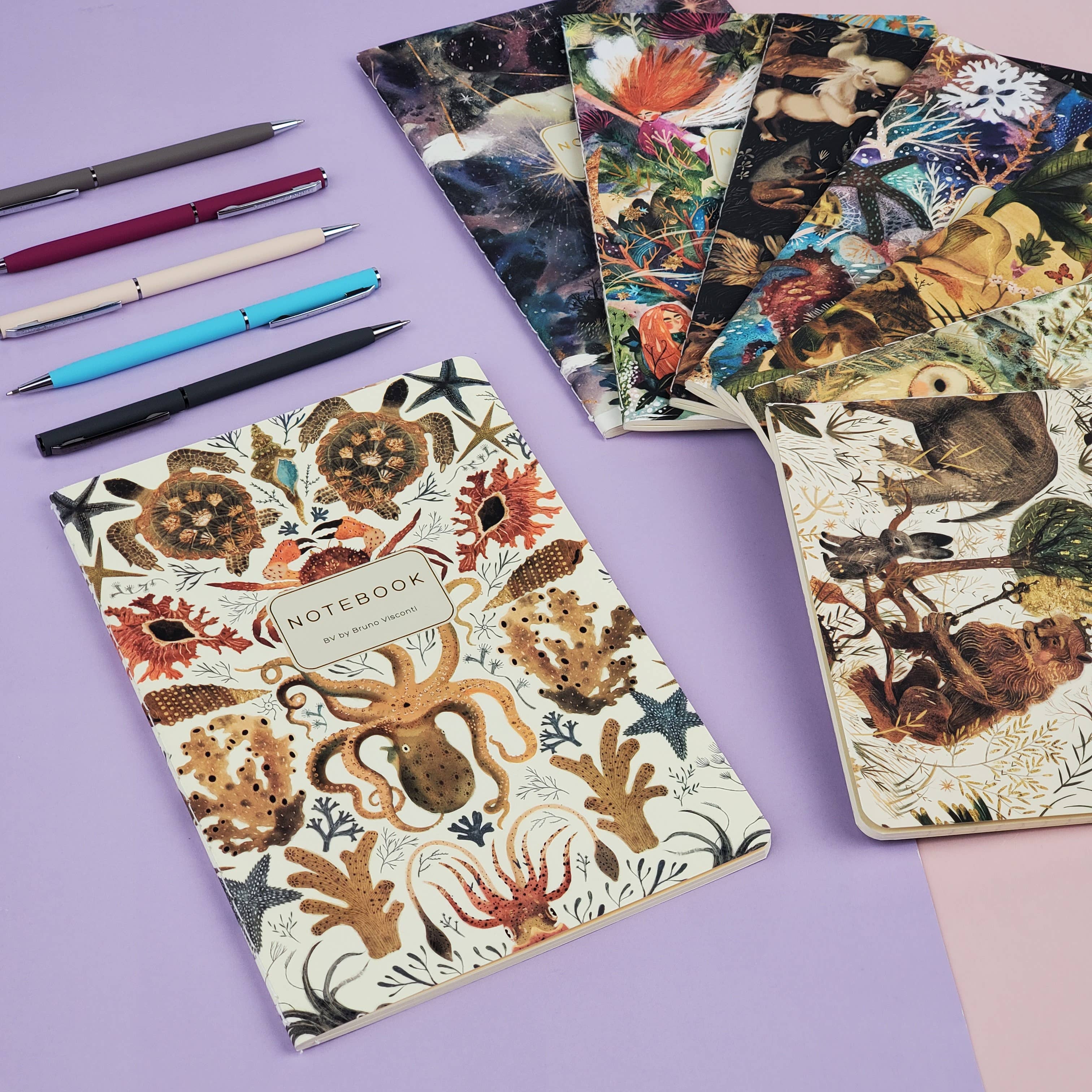 Notebooks with animal-themed covers on a purple background
