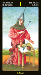 Card from a tarot deck featuring 'The Magician' with a person in a red robe and pointed hat, a dog, and various objects on a table.