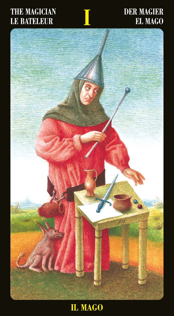 Card from a tarot deck featuring 'The Magician' with a person in a red robe and pointed hat, a dog, and various objects on a table.