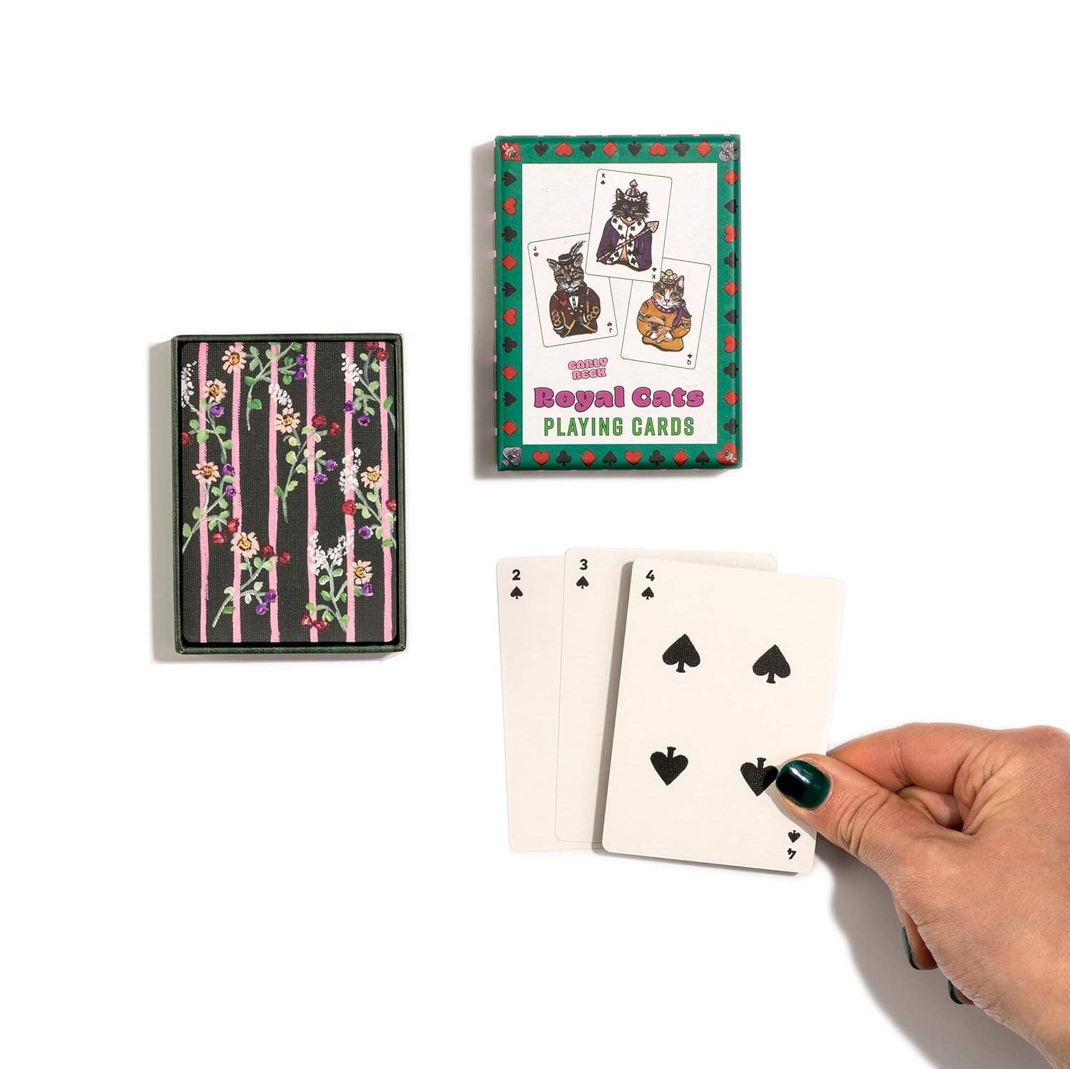 Playing cards with cat design and a hand holding two cards.