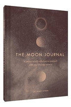 Book titled 'The Moon Journal' with celestial design on cover