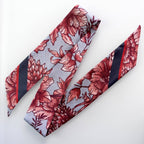 Floral patterned tie on a white background