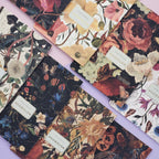 Collection of floral and nature-themed notebooks with visible brand labels.