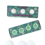 Bath bomb trio packaging with floral design on a white background