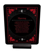 Decorative plaque with red text and butterfly designs on a black background
