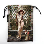 Drawstring bag with artistic design of a woman in a garden setting, featuring a lattice and flowers.