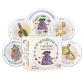 Packaging of 'Wisdom of Charms' oracle deck with illustrated cards on a white background